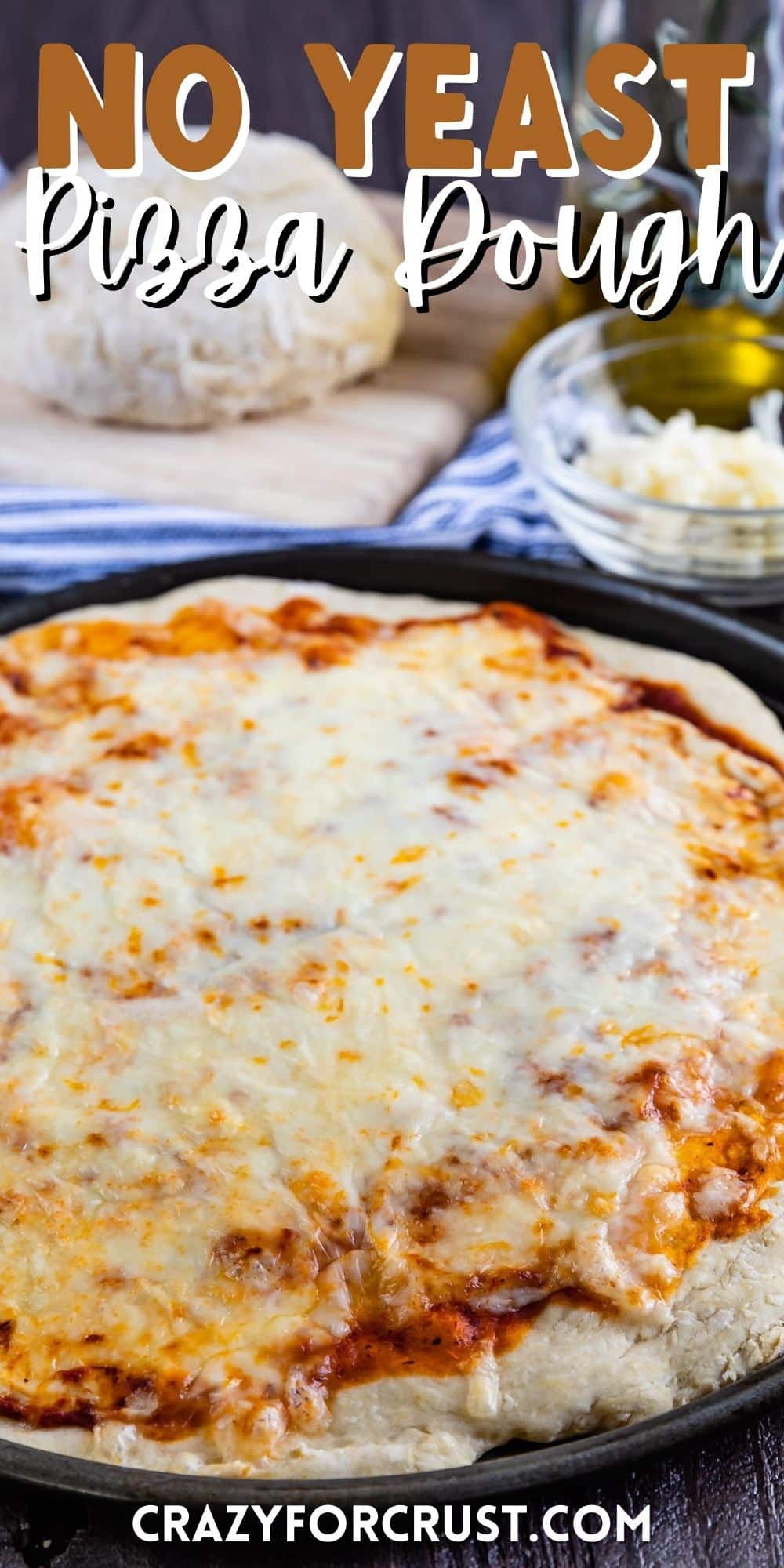 pizza in a black pizza pan with words on the image