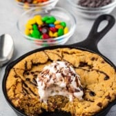 cookie pie in a small pan with ice cream on top