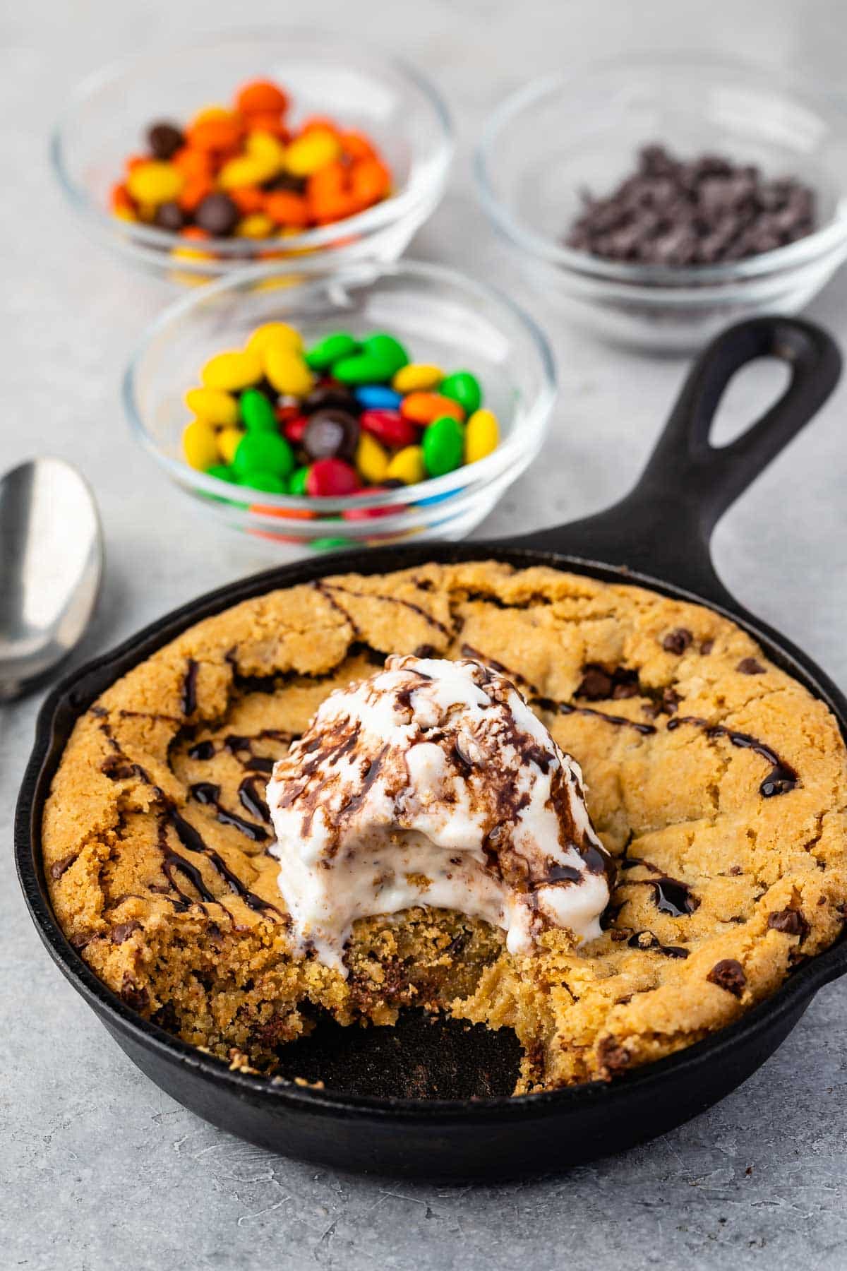 cookie pie in a small pan with ice cream on top