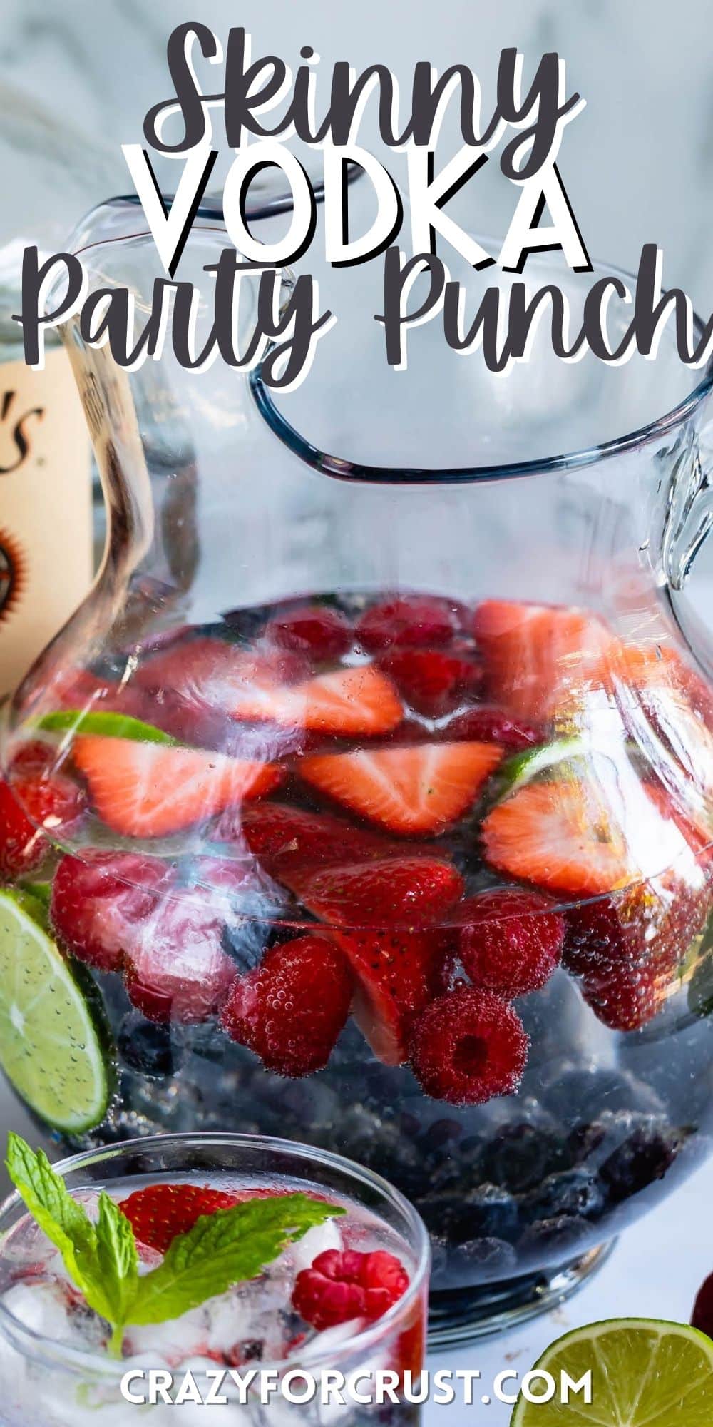 clear glass with a clear drink, and fruit in the glass with words on top