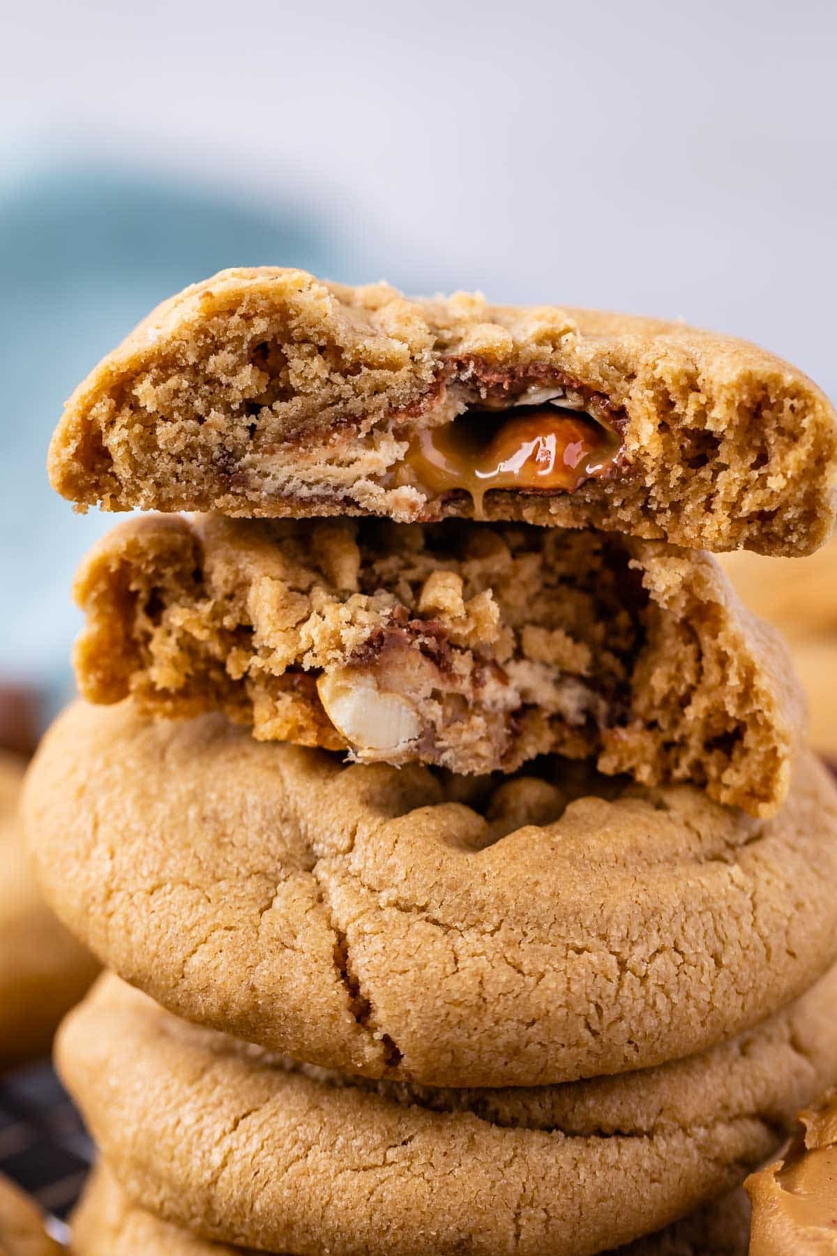 stacked peanut butter cookies with a snickers baked inside.