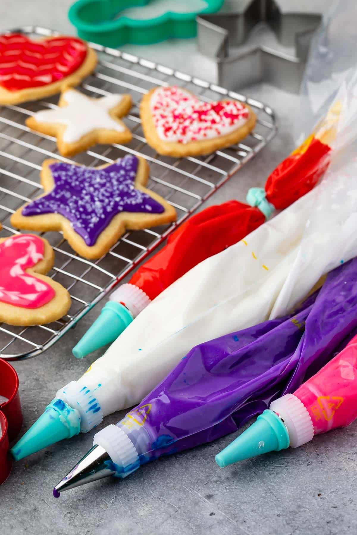 white, red, pink, and purple bags of frosting