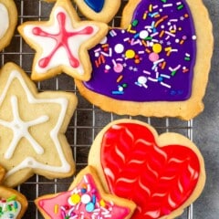 sugar cookies with various colored icing and sprinkles on top
