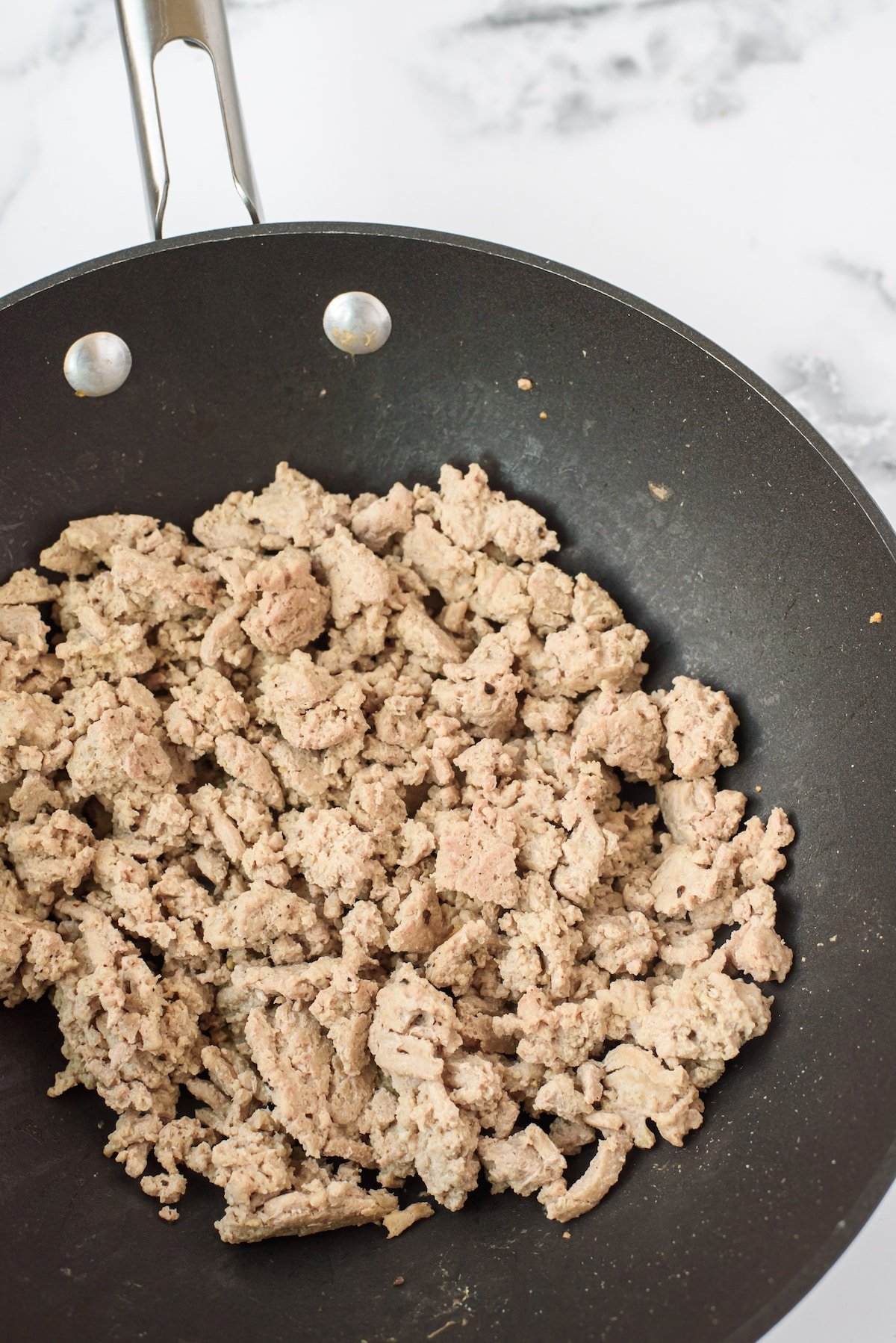 meat in a black pan