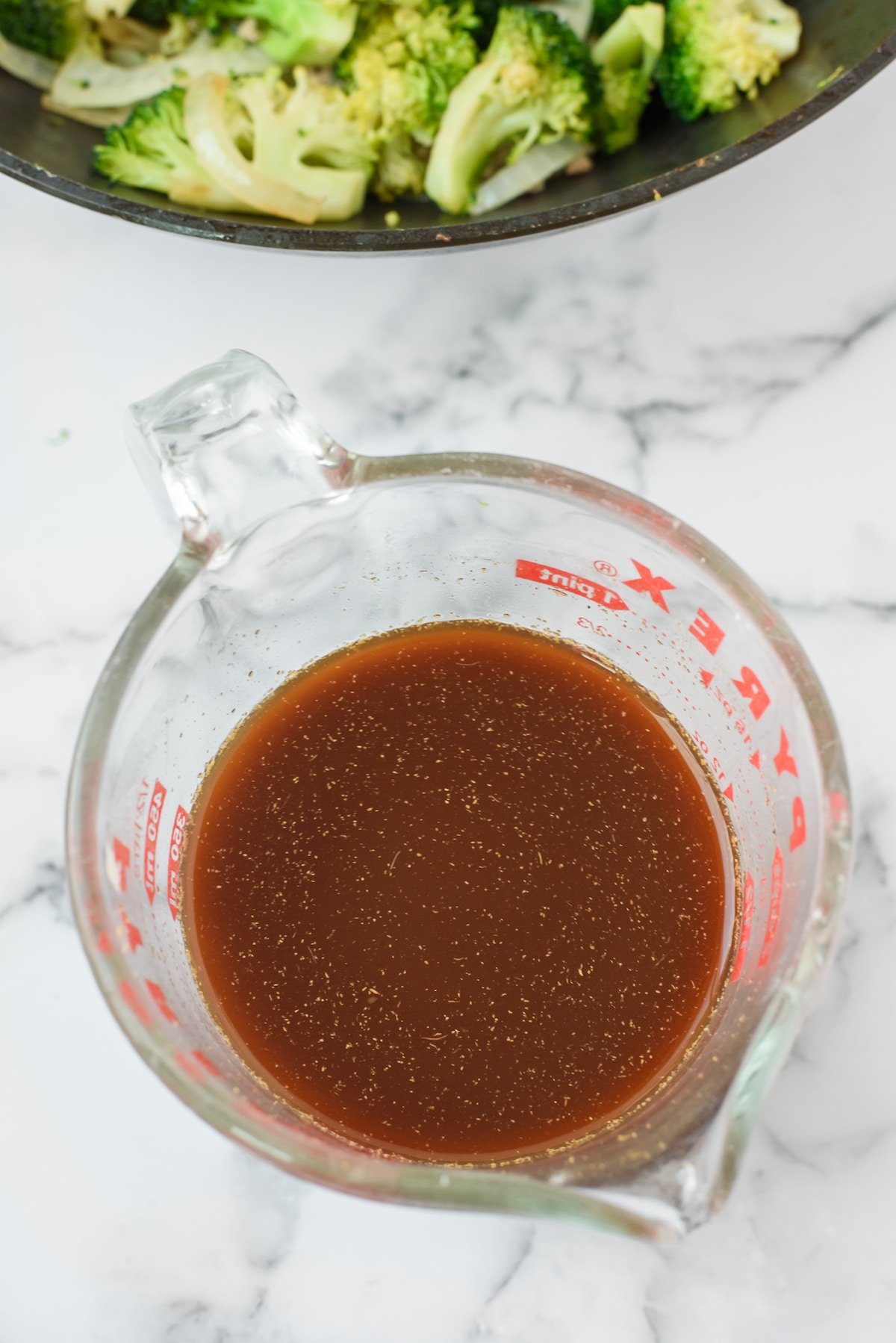 sauce in a clear measuring glass