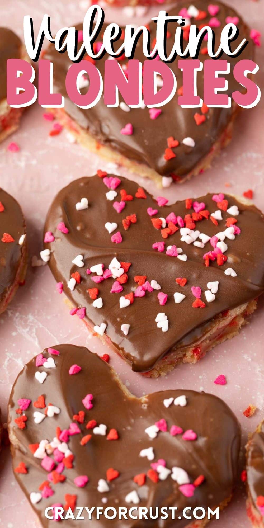 heart shaped sugar cookies with chocolate frosting and red sprinkles on top with words on the image