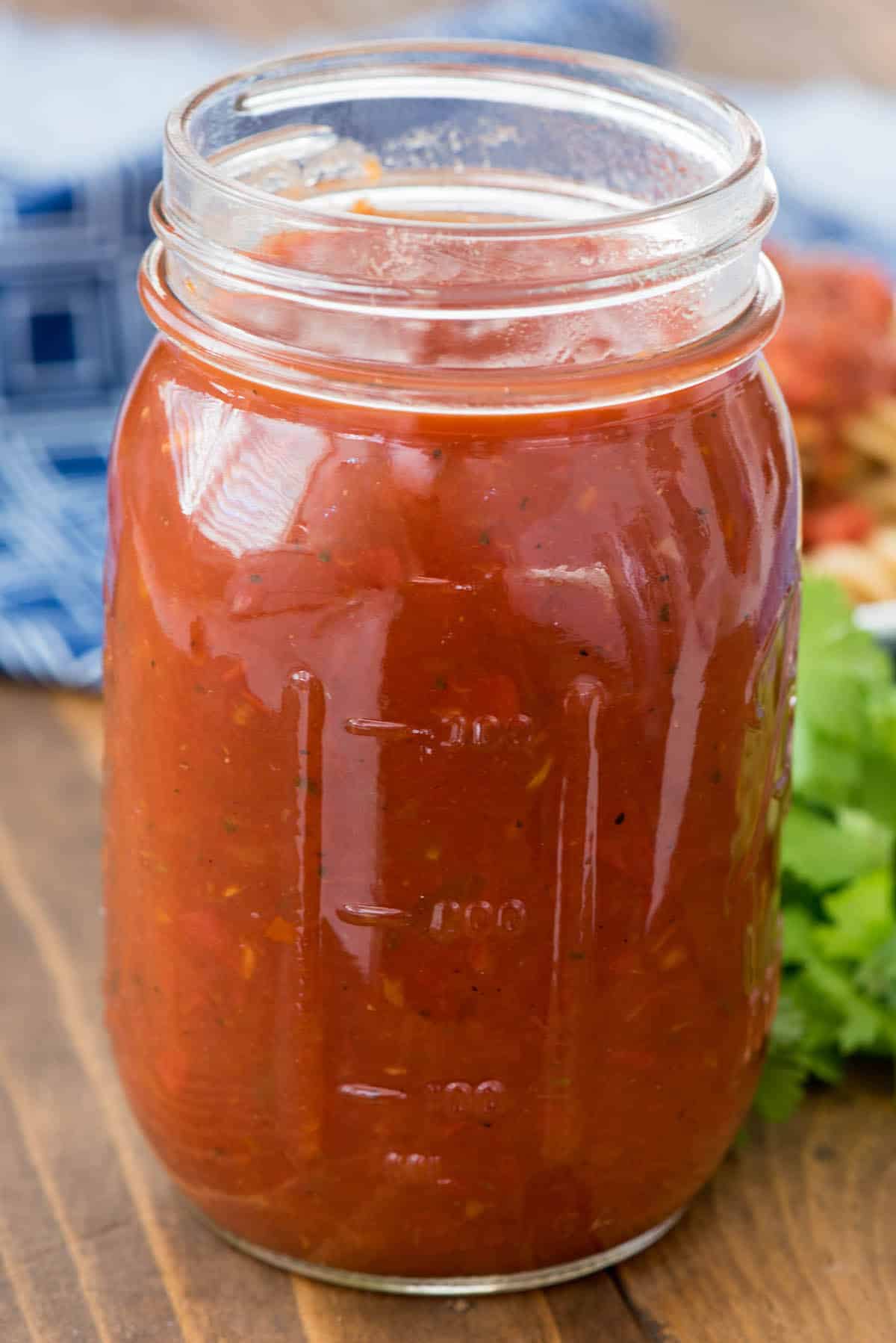 tomato sauce in a clear jar.