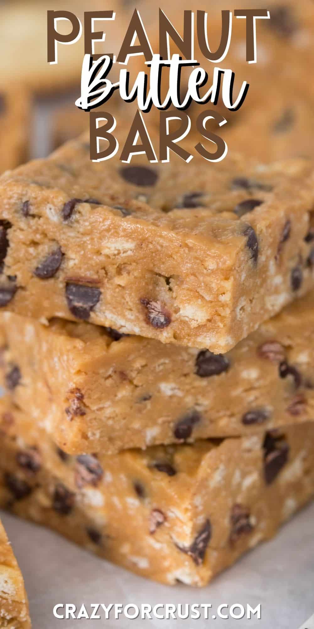stacked peanut butter bars with chocolate chips baked in with words on the image.
