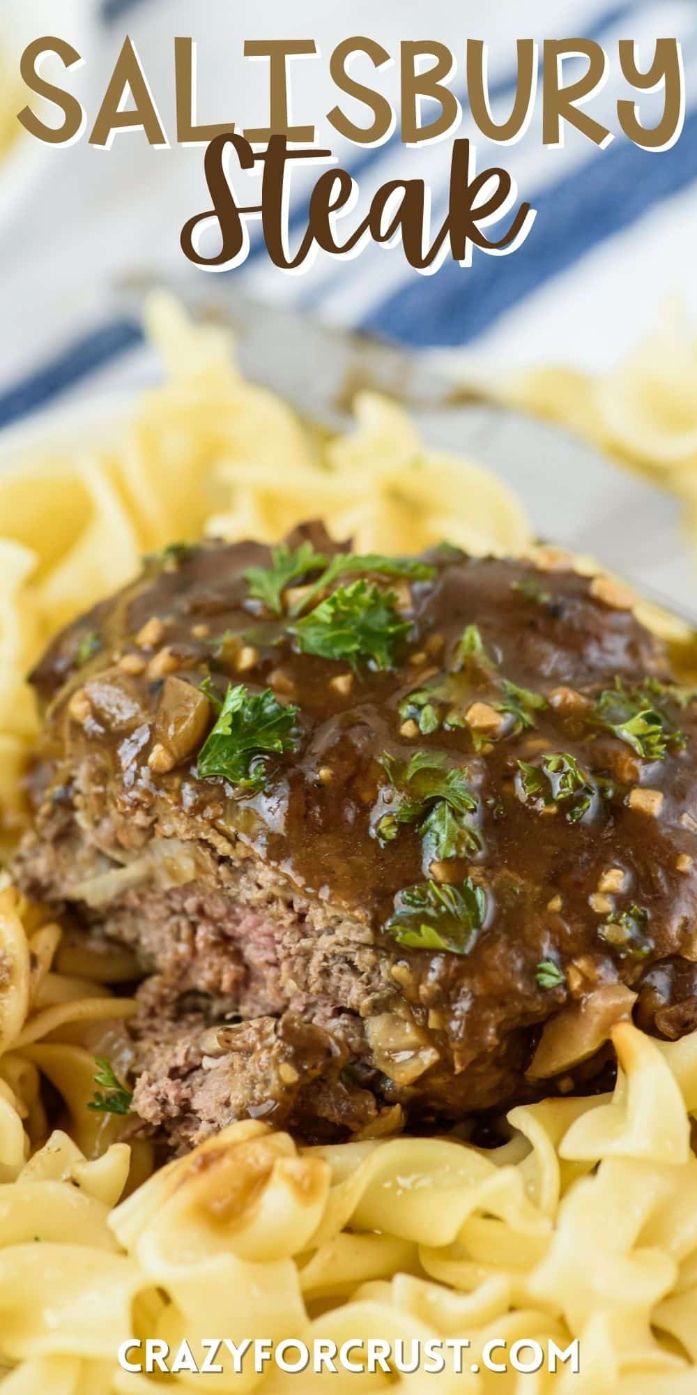 steak on top of pasta and covered in sauce with words on the image.