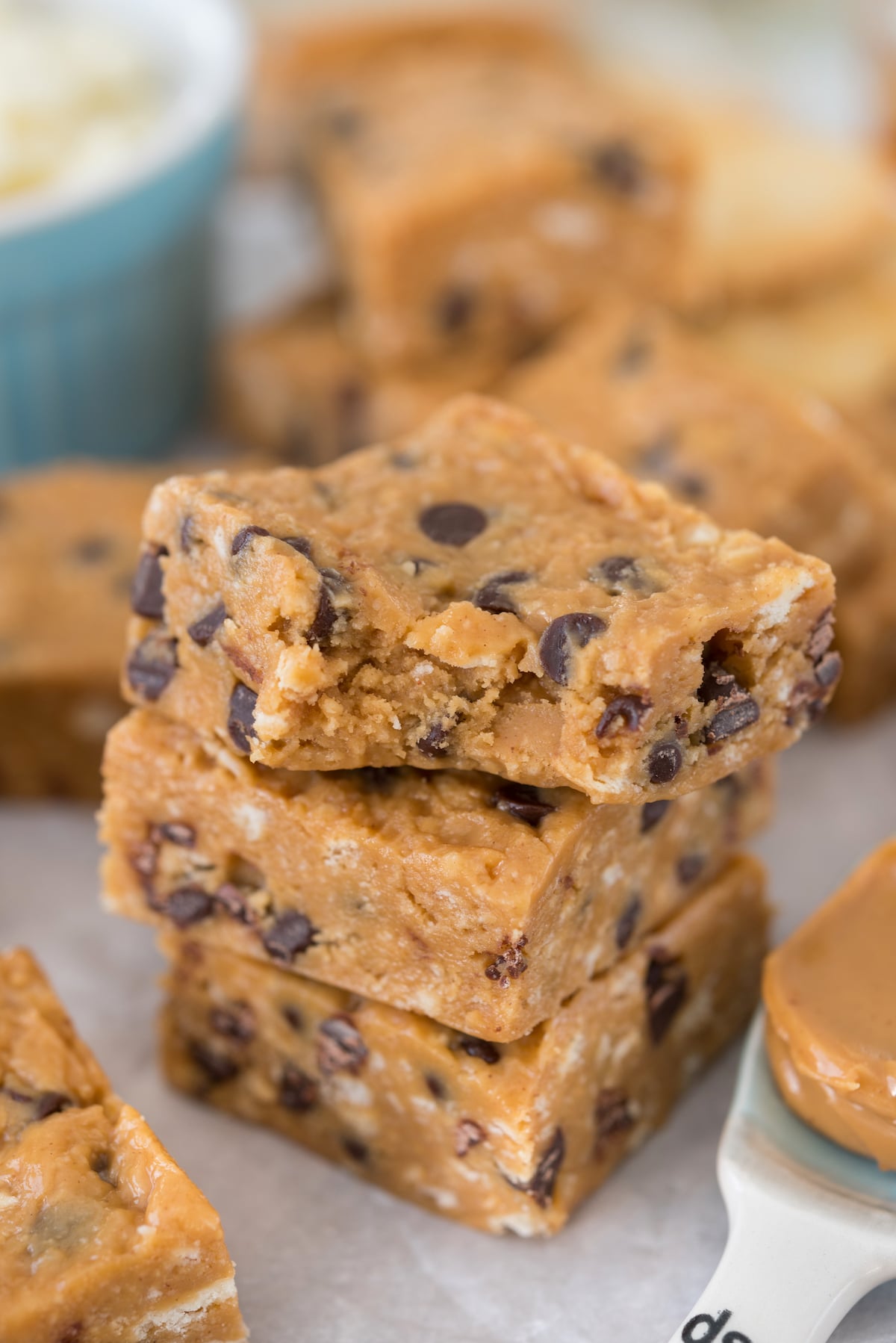 stacked peanut butter bars with chocolate chips baked in.