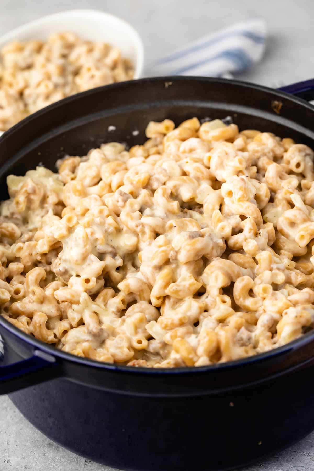 Mac and cheese in a black pan.