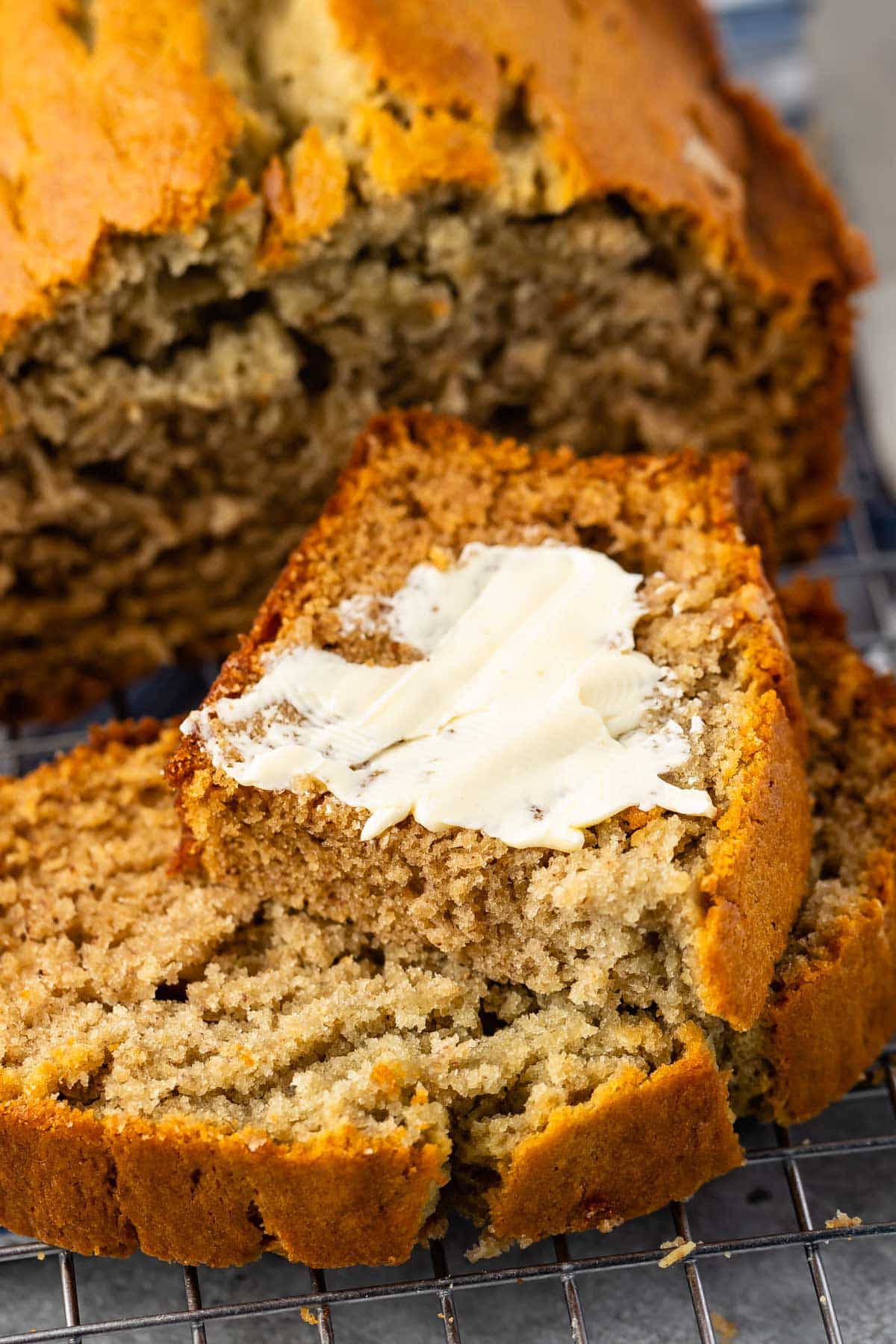 sliced banana bread on a drying rack.