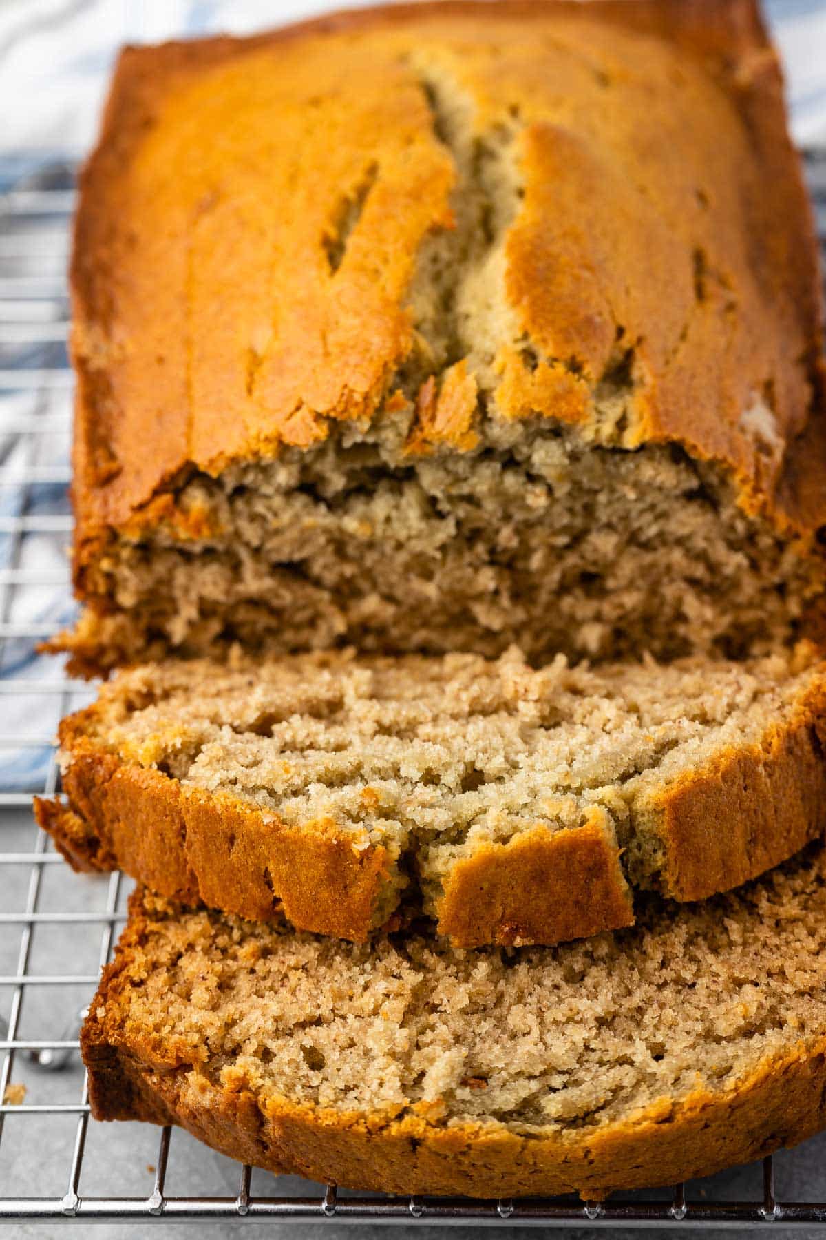 sliced banana bread on a drying rack.