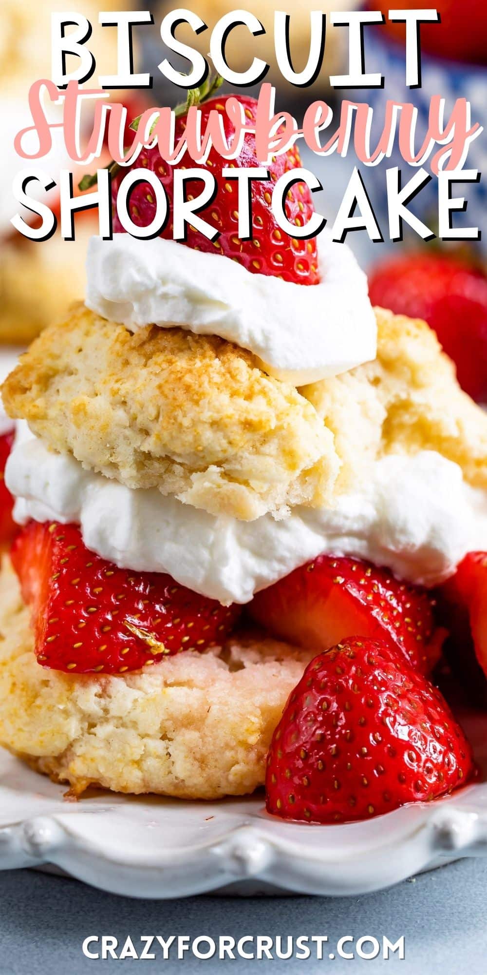 biscuits and strawberries and cream stacked on a white plate with words on the photo.