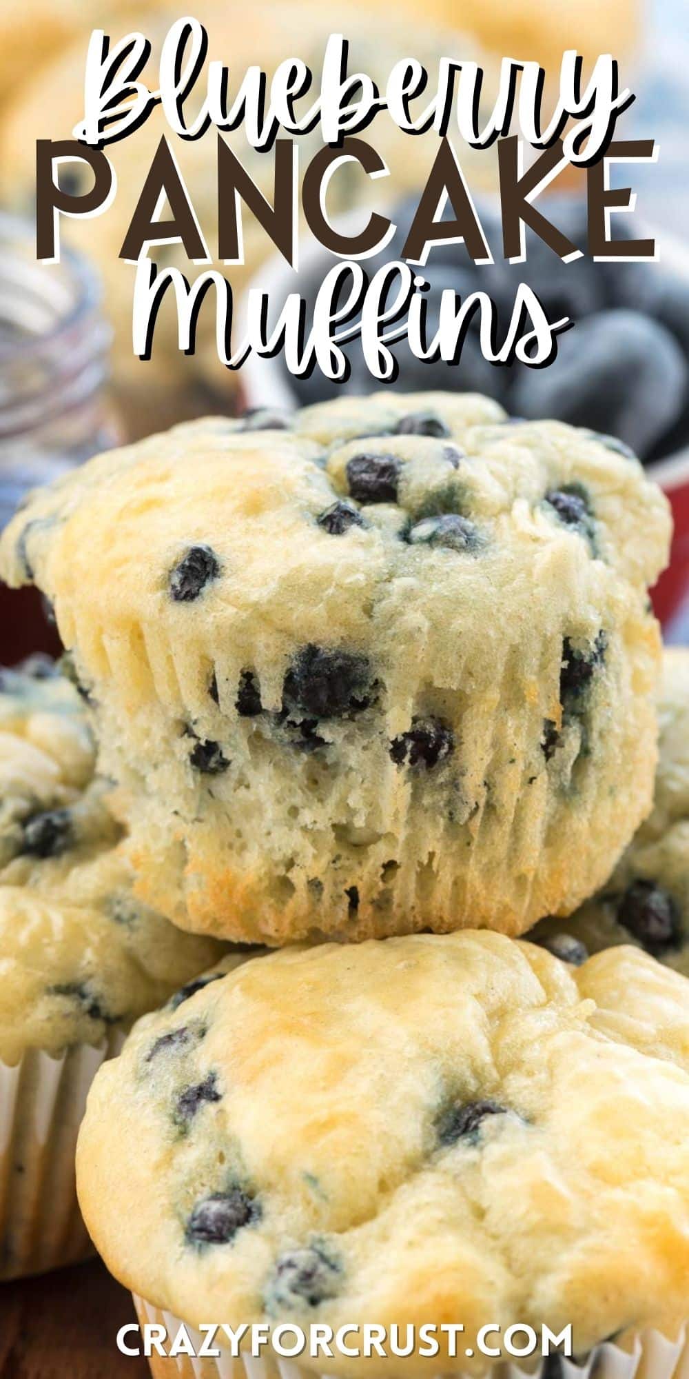 muffins stacked on other muffins with blueberries baked in with words on the image.