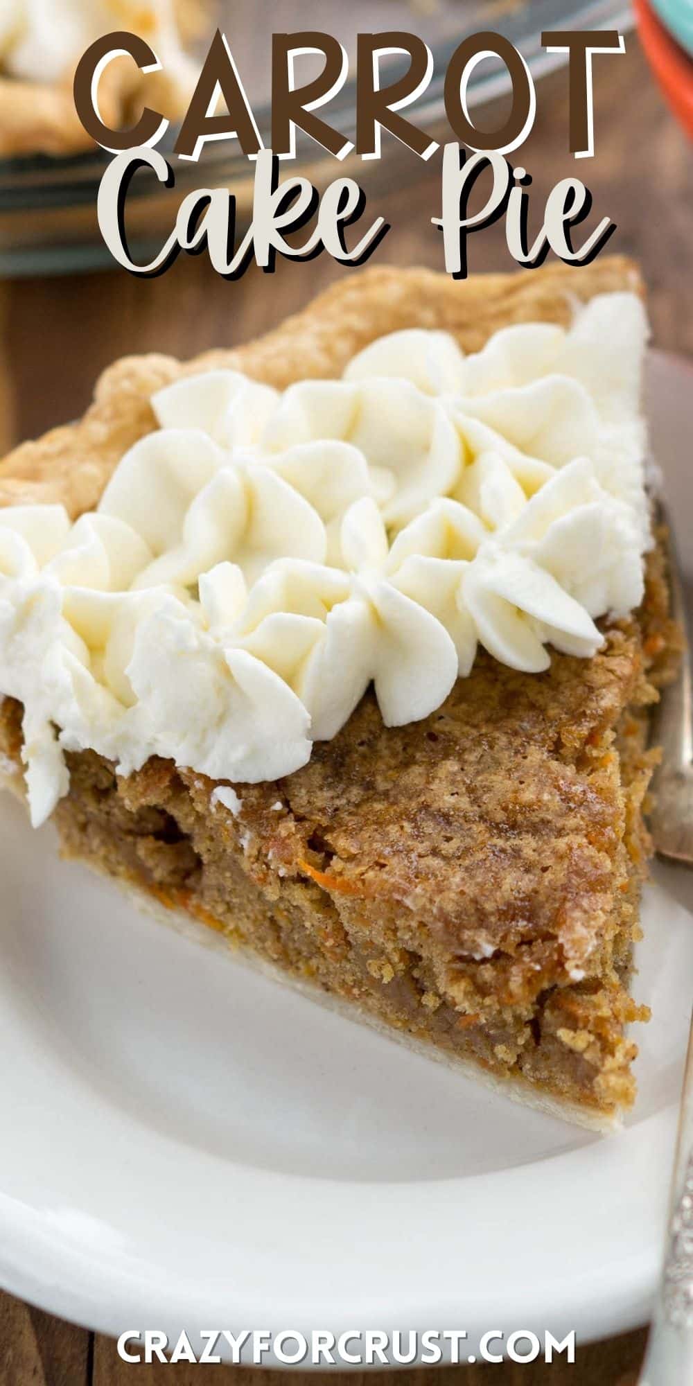 slice of carrot cake pie covered in white frosting on a white plate with words on the photo.