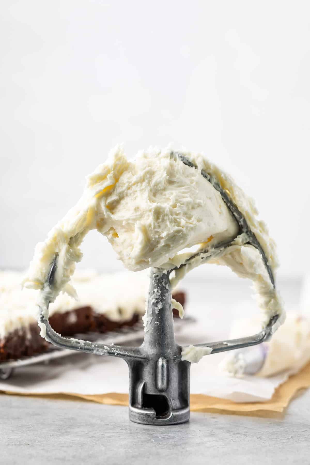 coconut frosting on the mixer hand.