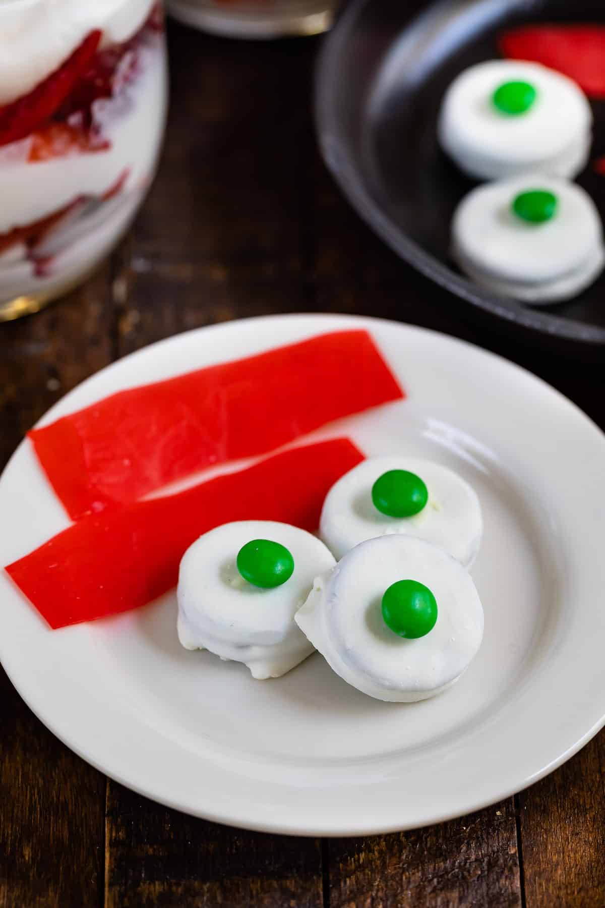 green eggs and ham made from various candies on a white plate.