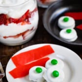 green eggs and ham made from various candies on a white plate.