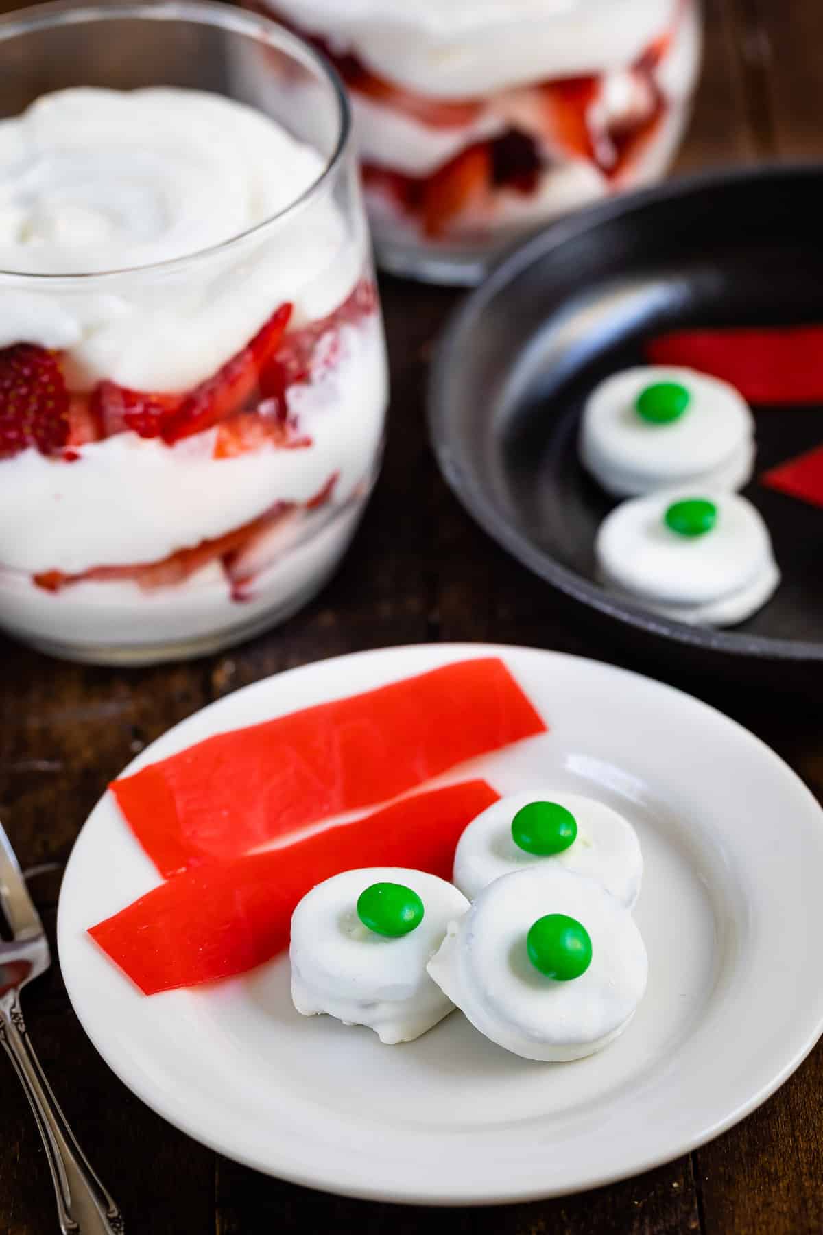 green eggs and ham made from various candies on a white plate.