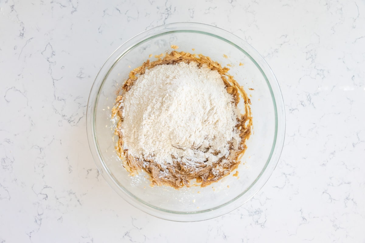 bowl of cookie dough with flour.