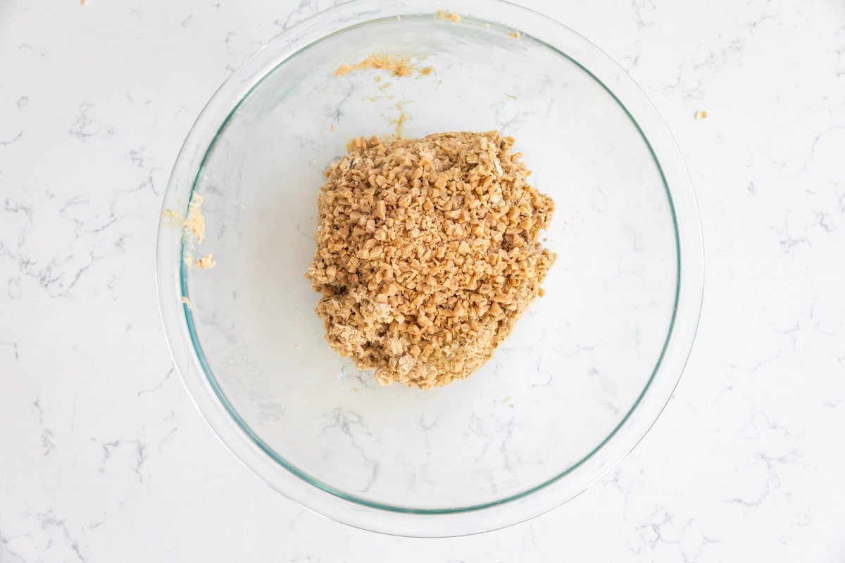 bowl of oatmeal cookie dough with toffee bits