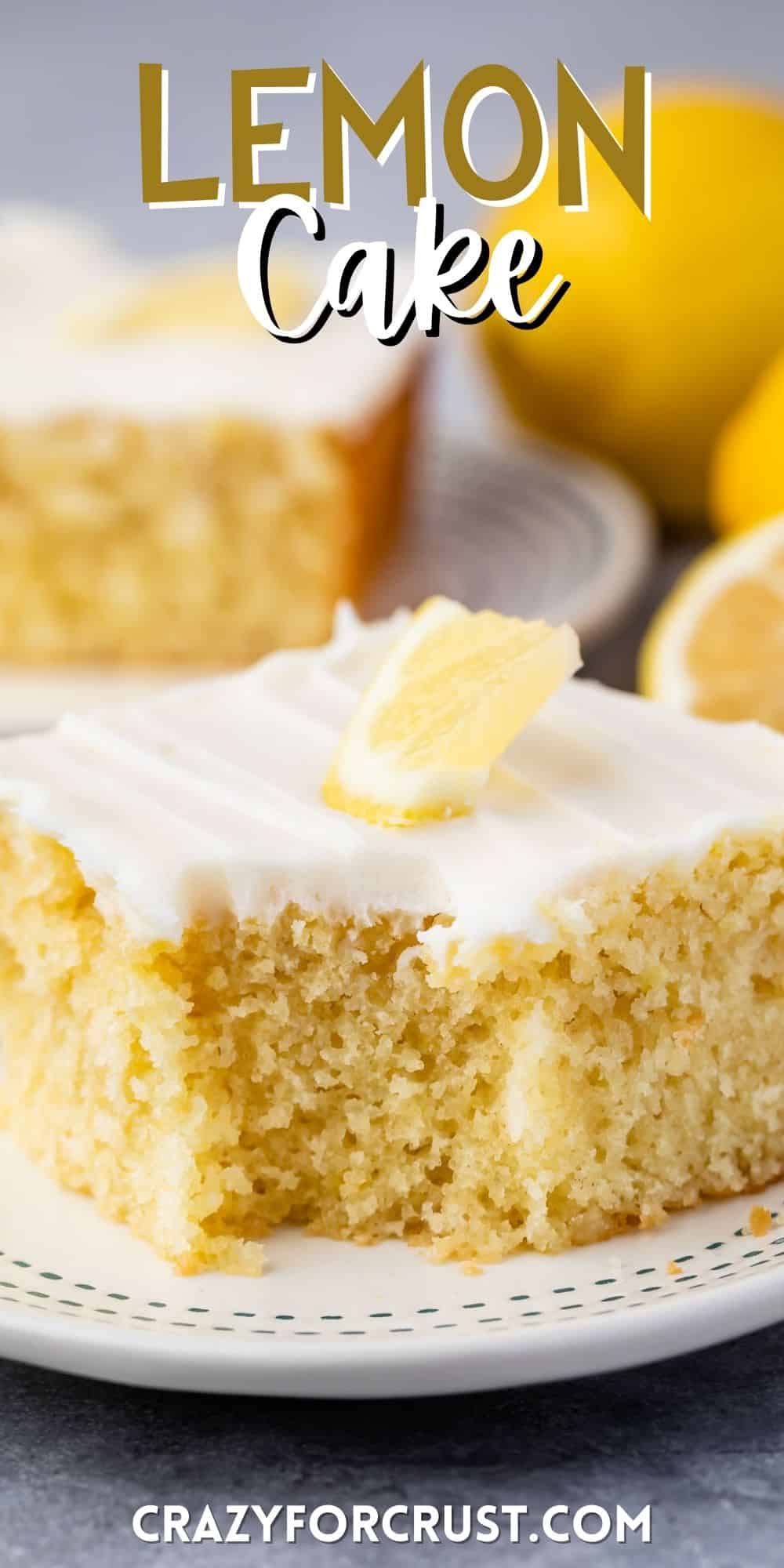 lemon cake with white frosting and a lemon slice on top with words on top.