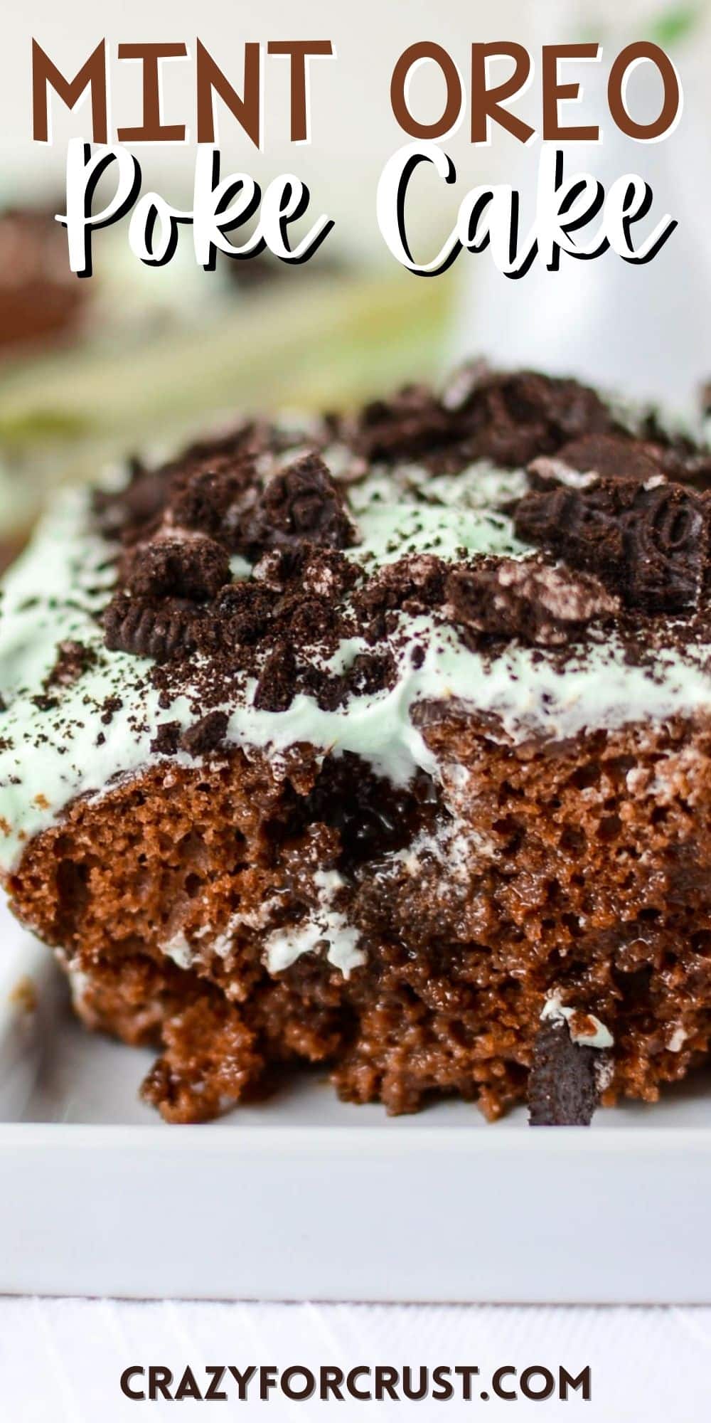 chocolate cake with mint frosting and oreo pieces on top with words on the image.