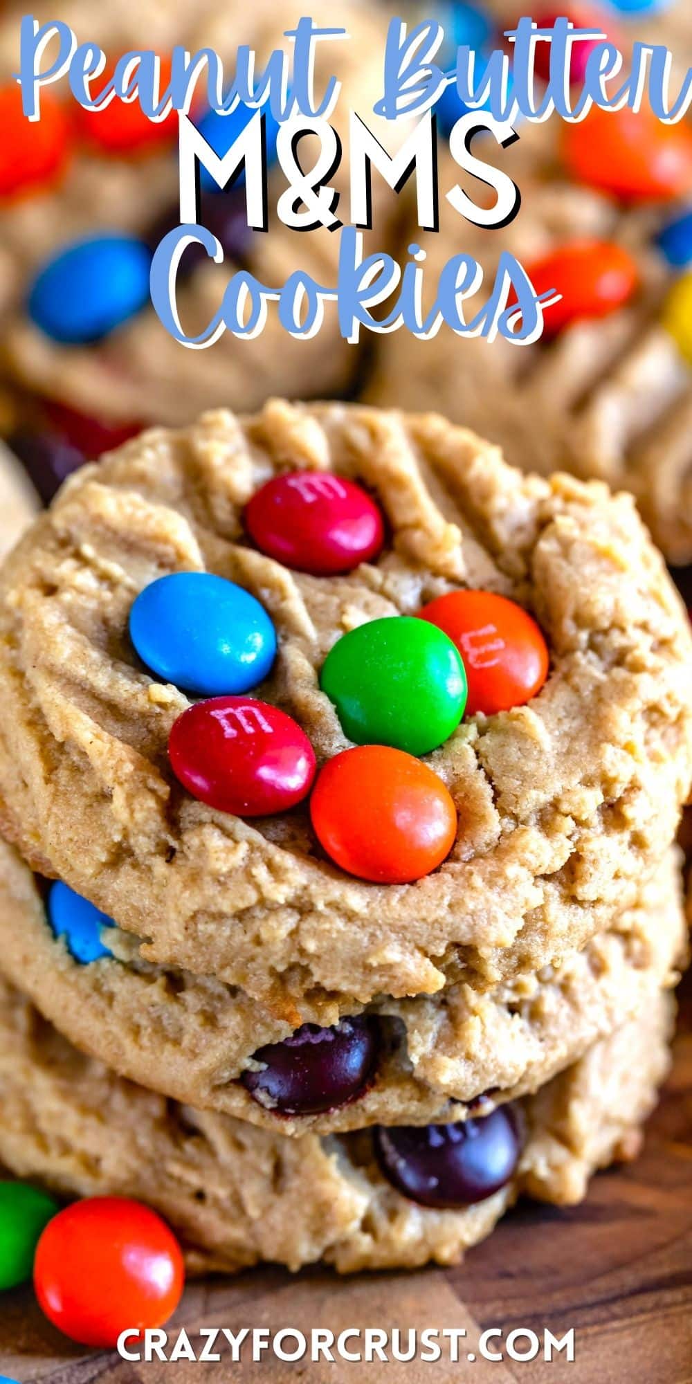 peanut butter cookies with colorful m&ms baked in with words on the image.