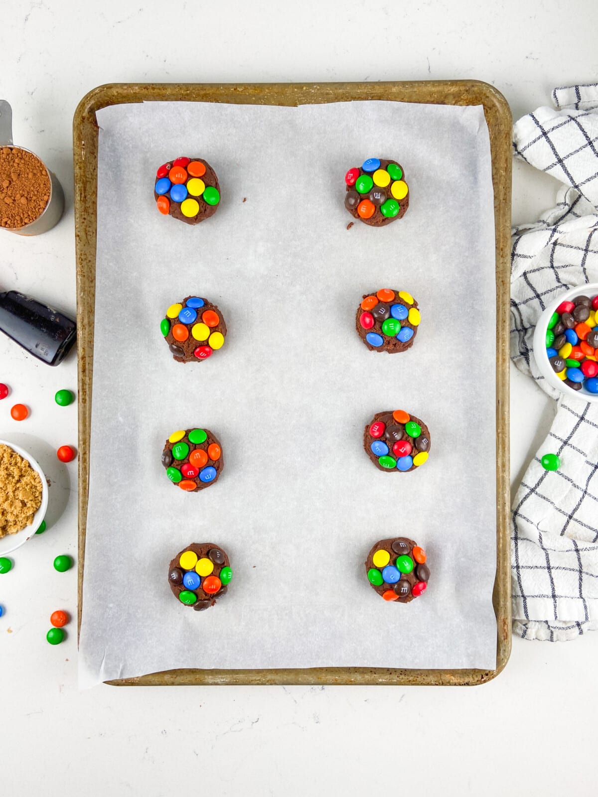 8 Cookies on a cookies sheet.