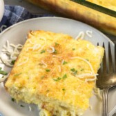 square slice of egg casserole with green chilis baked in.