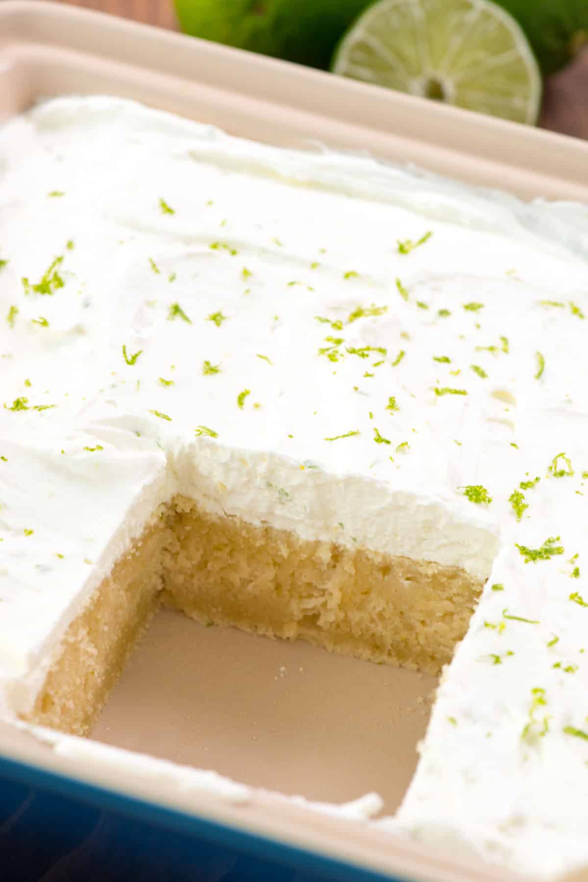 one slice of key lime cake with a sliced lime on top.