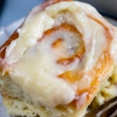 cinnamon rolls with icing on top.