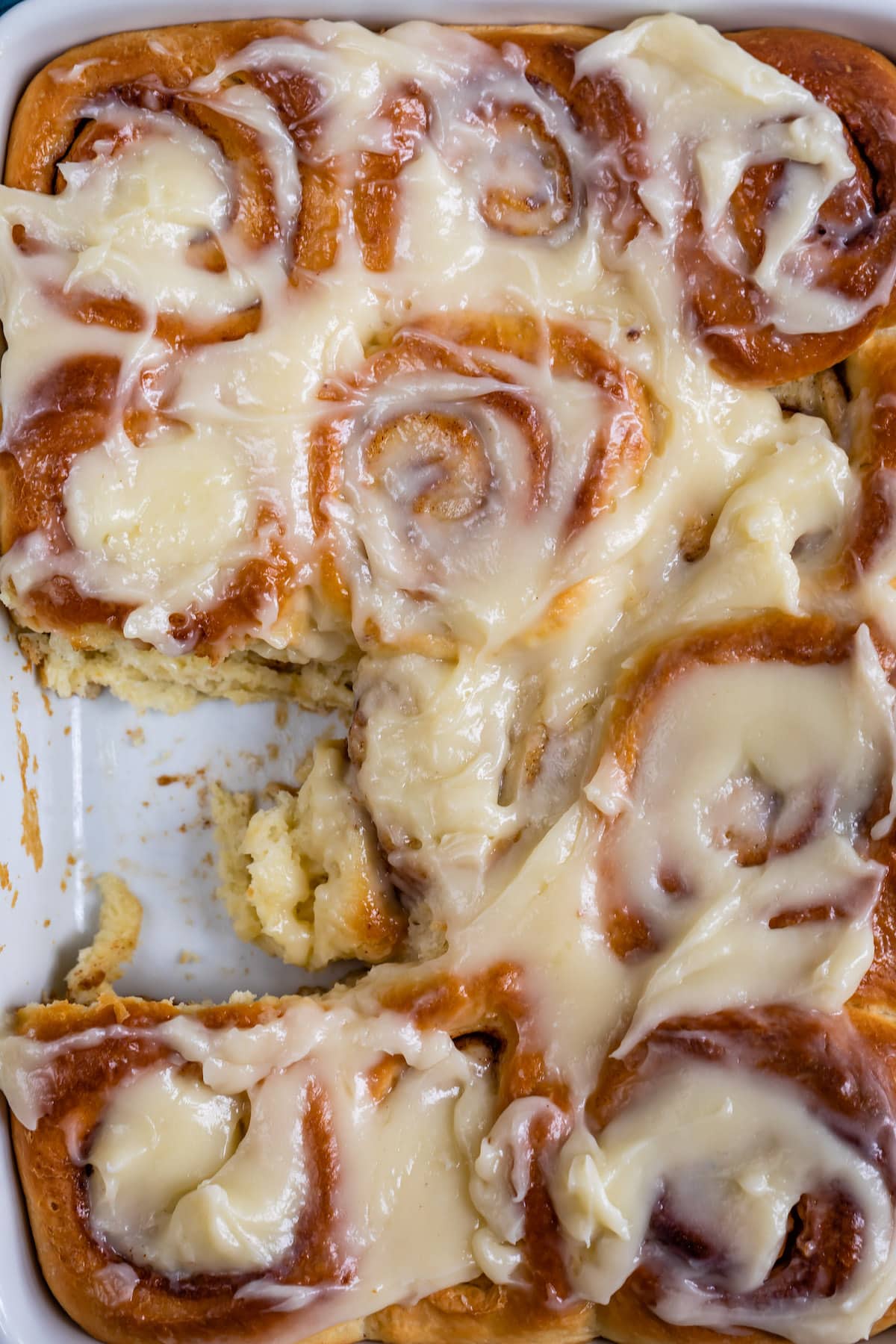 cinnamon rolls with icing on top.