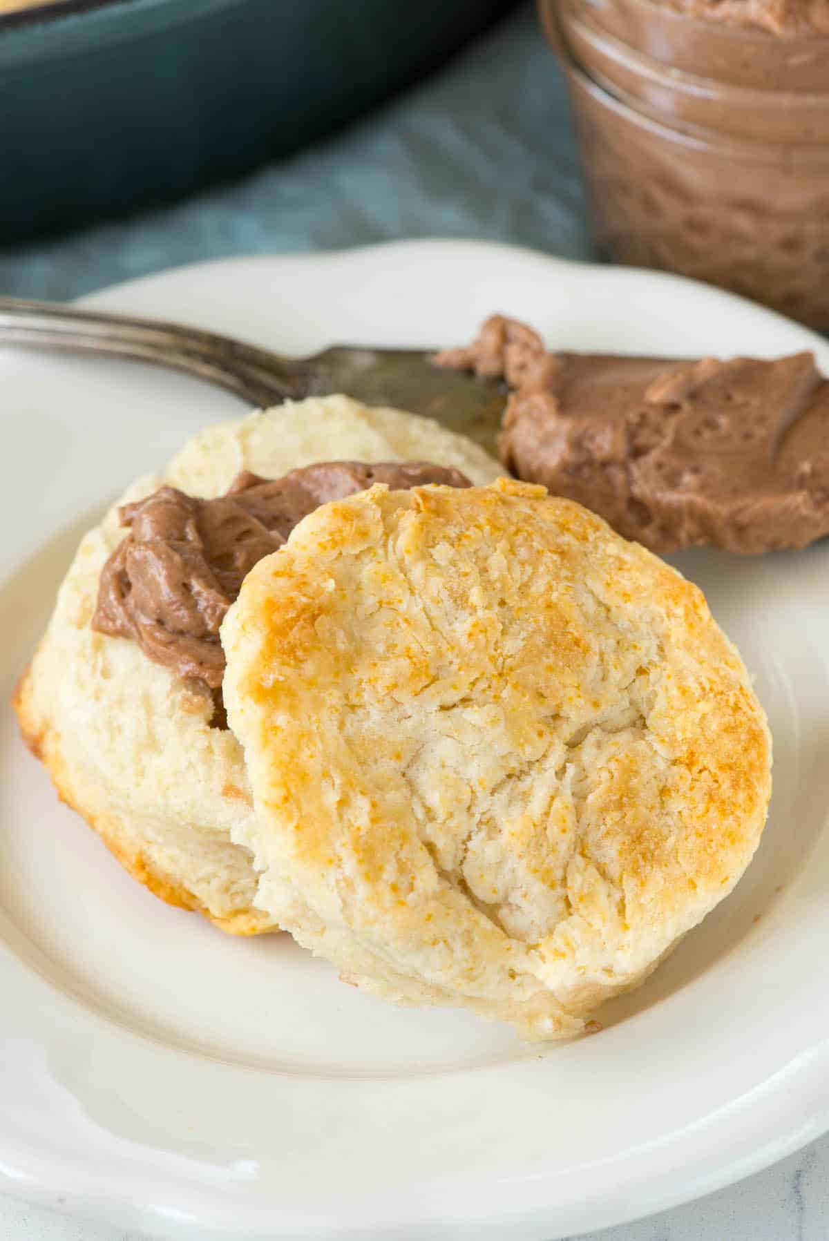 biscuits with chocolate homey butter spread on the biscuits.