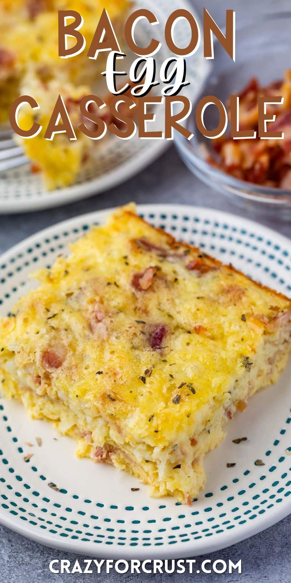 one slice of egg casserole with bacon baked in with word on the photo.