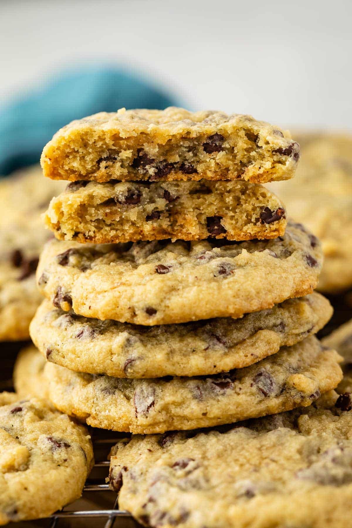 stacked cookies with chocolate chips baked in and bananas in the back.