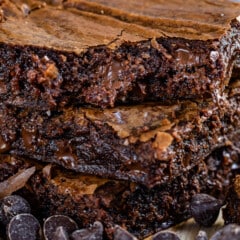 stacked brownies with chocolate chips sprinkled around.