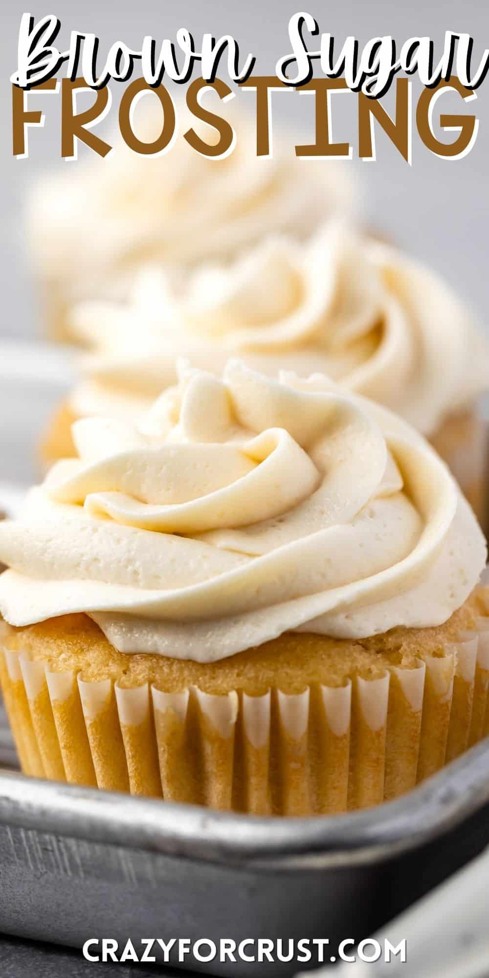 cream colored frosting swirled on top of a cupcake with words on the image.