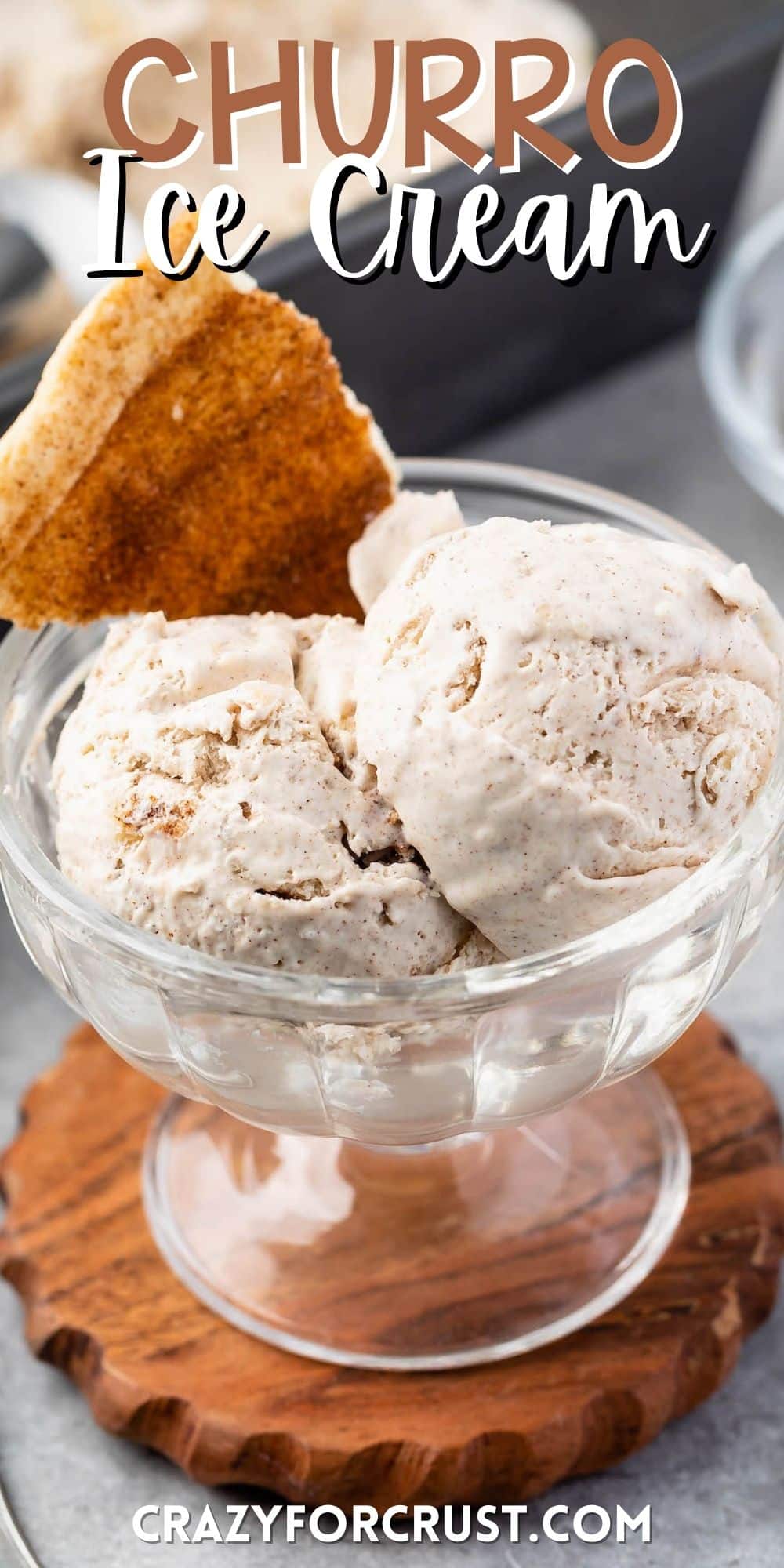 ice cream scooped into clear ice cream bowl and a churro piece mixed in with words on the image.