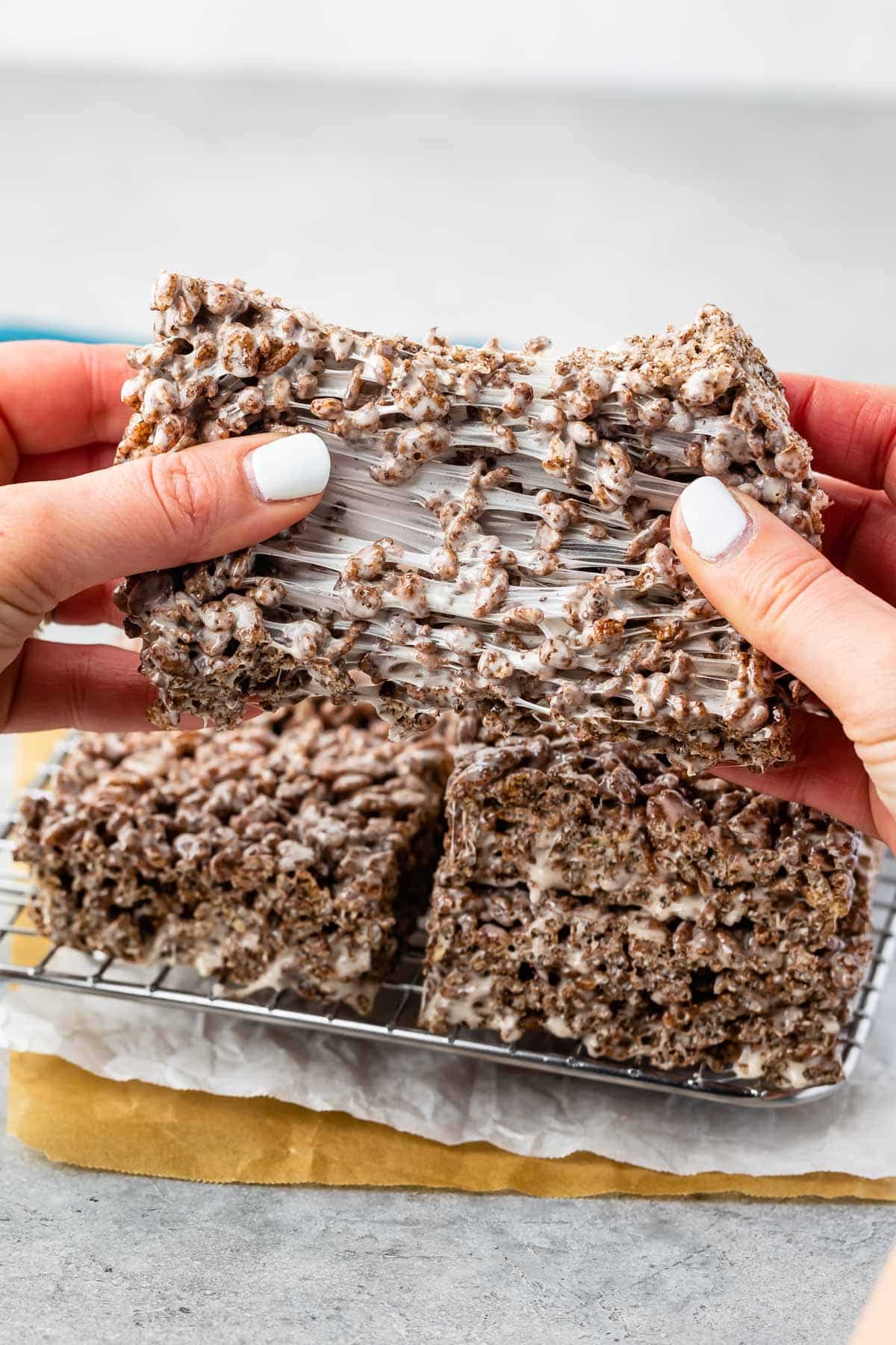 stacked Rice Krispie Treats made with cocoa pebbles.