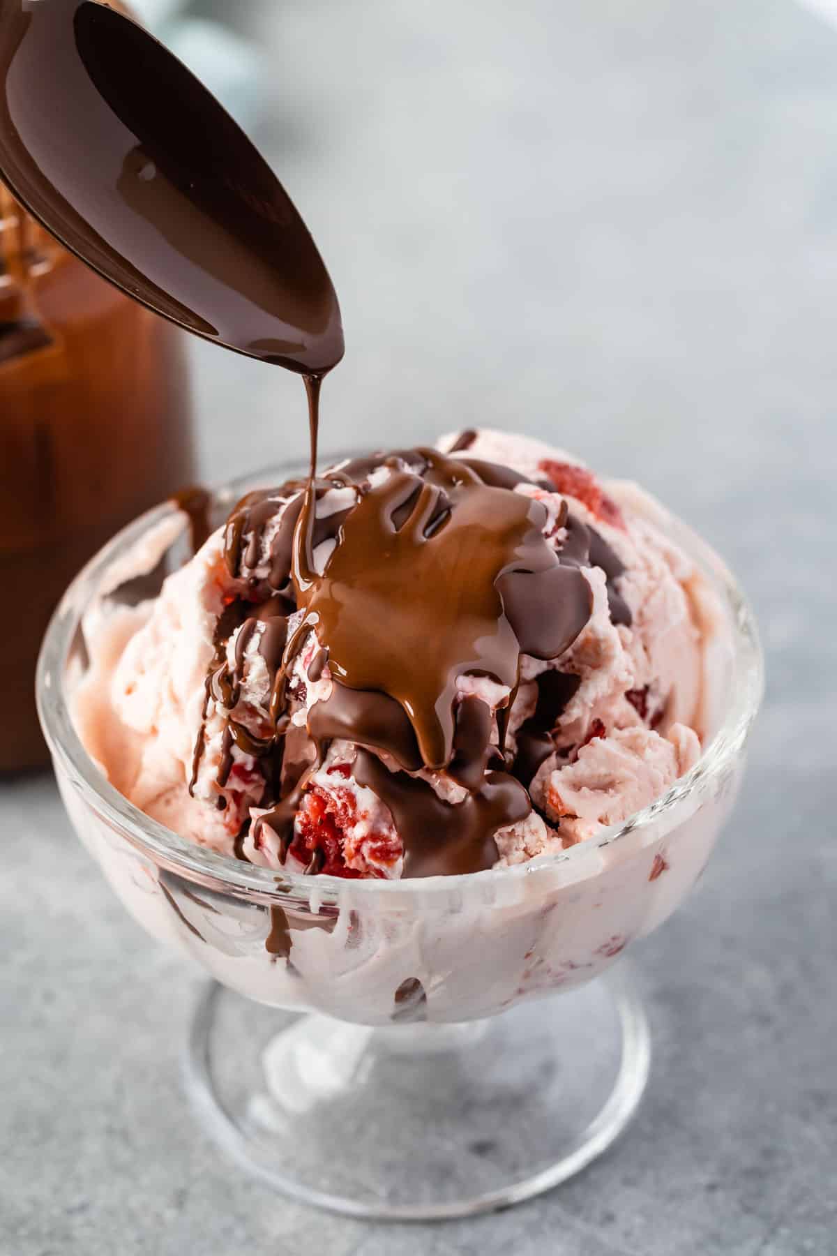 ice cream in a clear jar covered in the magic shell.