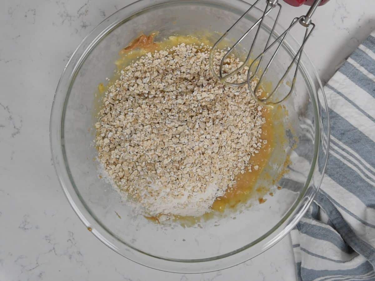 mixture with oats and flour in large clear bowl.