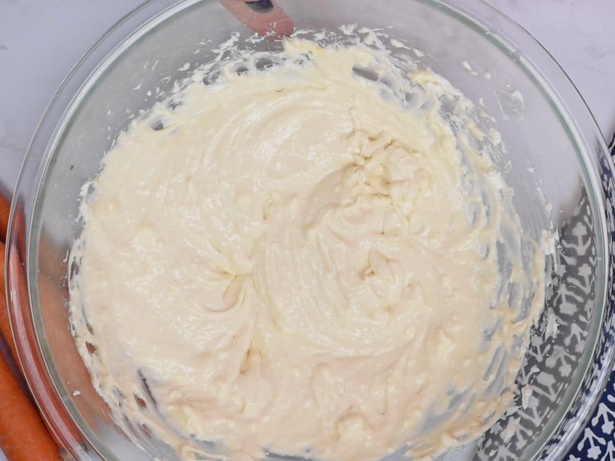 Cheesecake mixture in clear bowl.