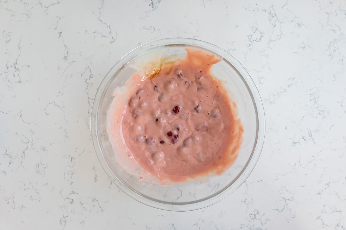 process shot of cherry ice cream pie.