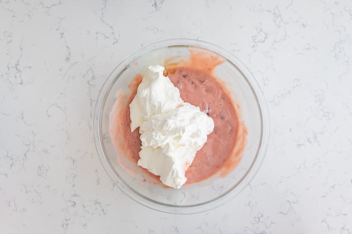 process shot of cherry ice cream pie.