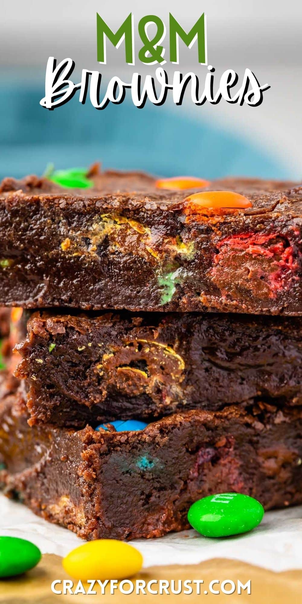 stacked brownies with colorful m&ms baked in with words on the image.