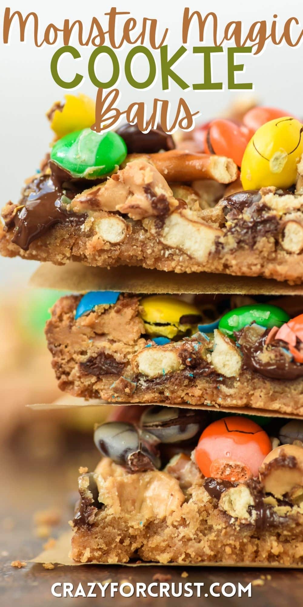 magic bars with nuts, pretzels and m&ms on top with words on the image.