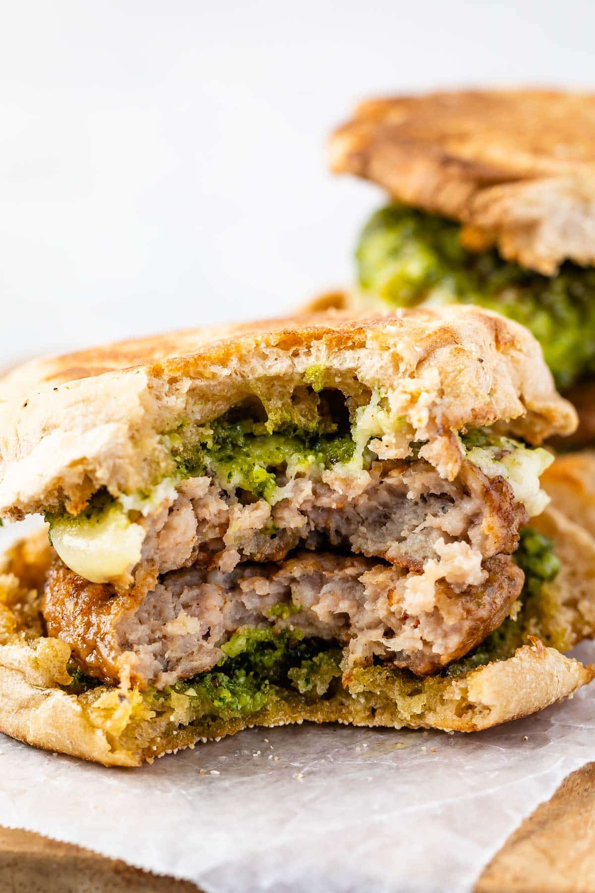 sausage cheese and pesto in a bun.