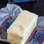 softened butter on wrapper with finger print.